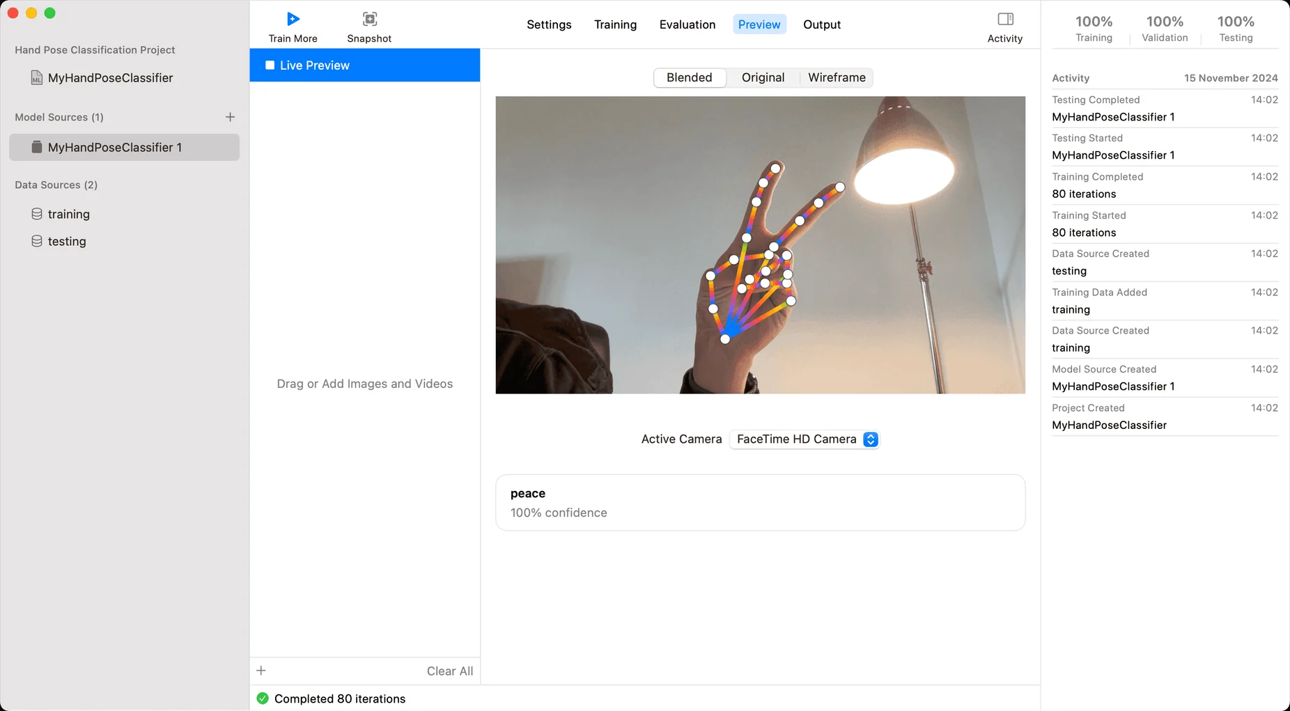 Create ML previewing a hand pose classifier: a peace sign detected with 100 % confidence