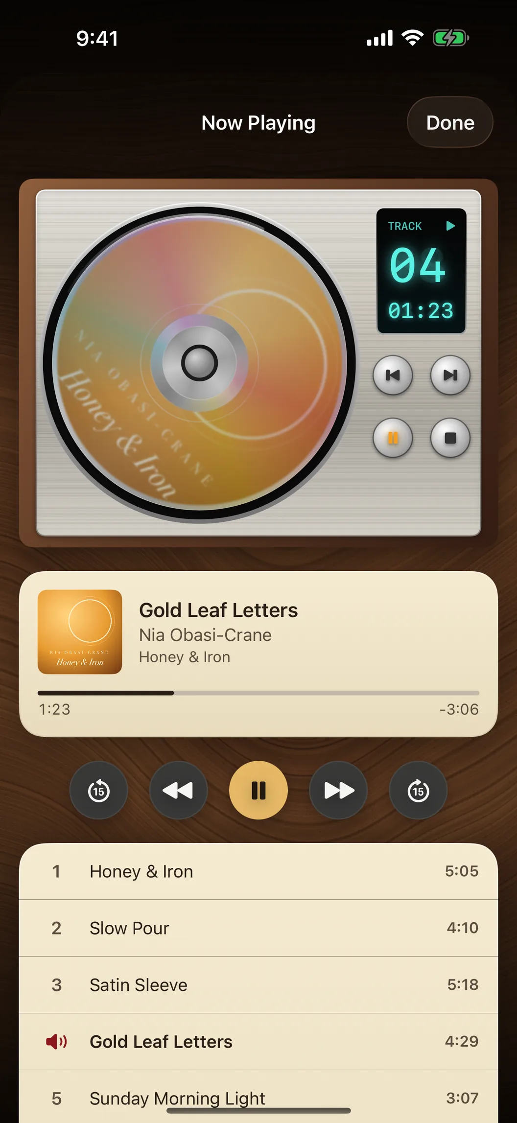 Recs CD player playing Honey & Iron by Nia Obasi-Crane, track 4 on its glowing display