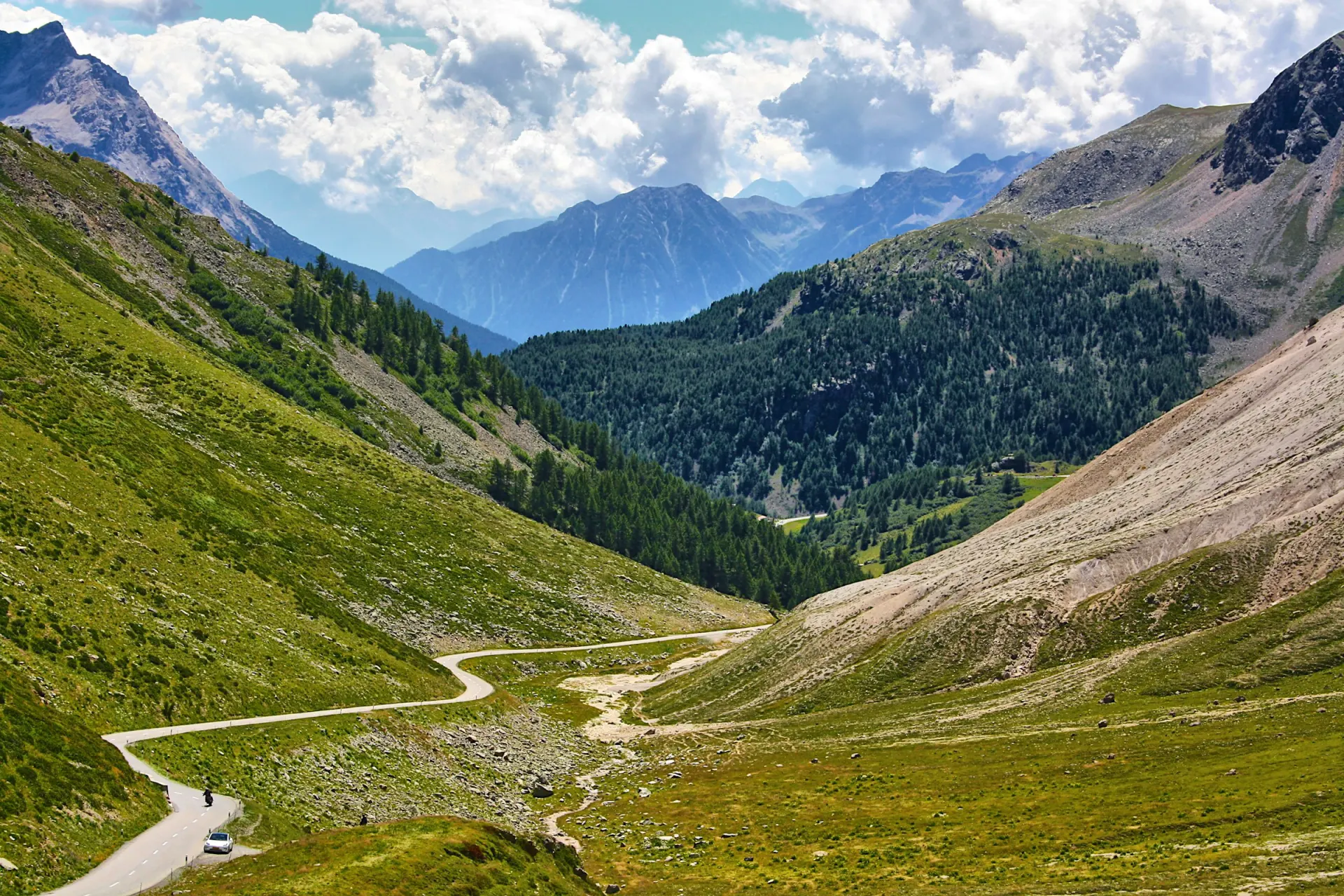A road winding up an Alpine pass